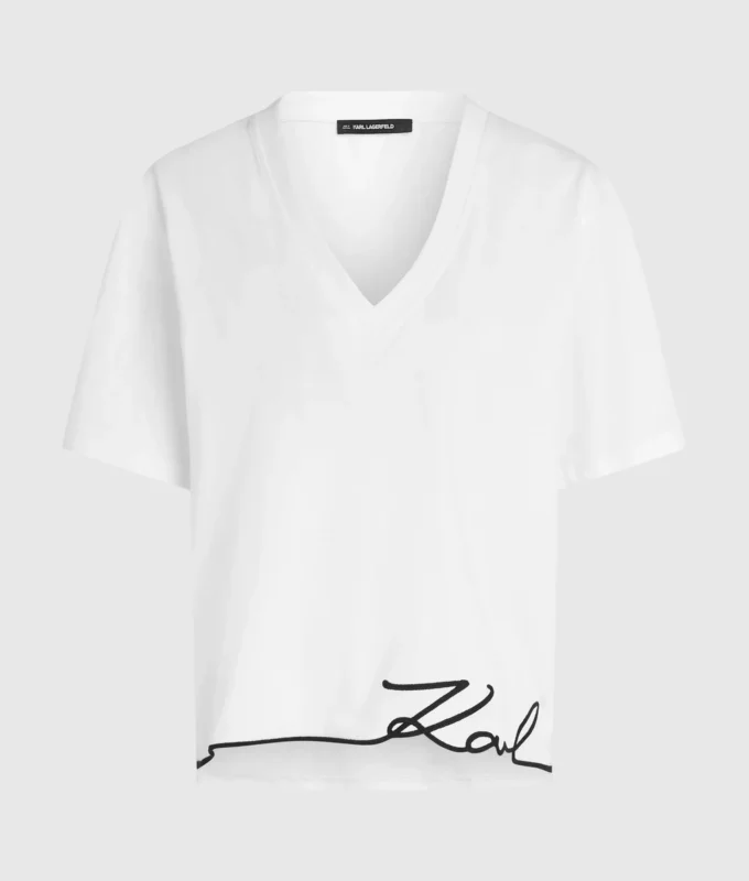 Camiseta con cuello en V y bajo característico Camiseta con cuello en V y bajo característico