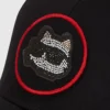 Gorra transformable con parches de pedrería Ikon