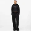 Pantalones de chándal con monograma y tachuelas Pantalones de chándal con monograma y tachuelas