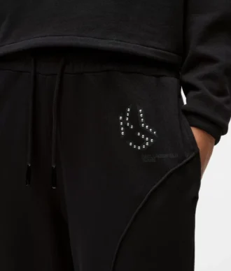 Pantalones de chándal con monograma y tachuelas