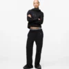 Pantalones de chándal con monograma y tachuelas Pantalones de chándal con monograma y tachuelas
