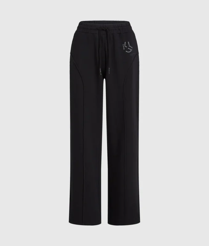Pantalones de chándal con monograma y tachuelas Pantalones de chándal con monograma y tachuelas