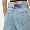 Vaqueros relajados de talle medio con costuras Vaqueros relajados de talle medio con costuras